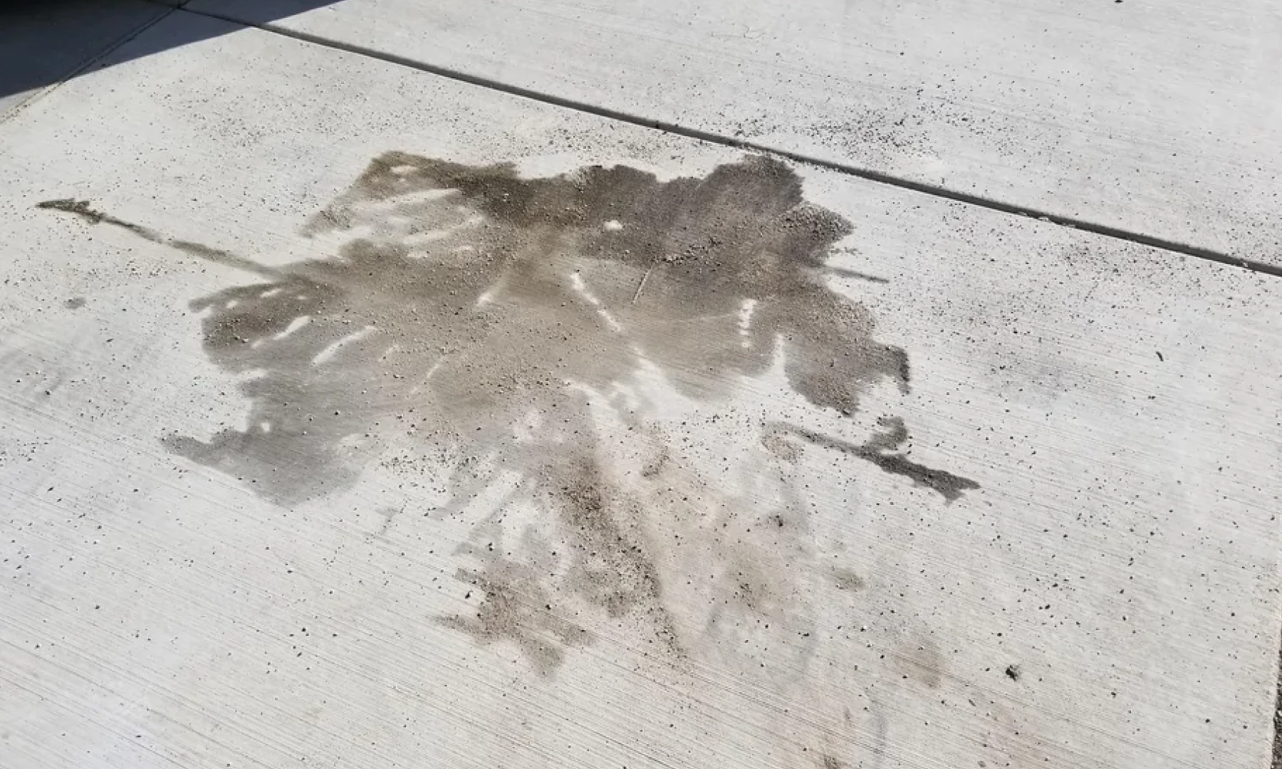 Concrete discoloration from waste oil